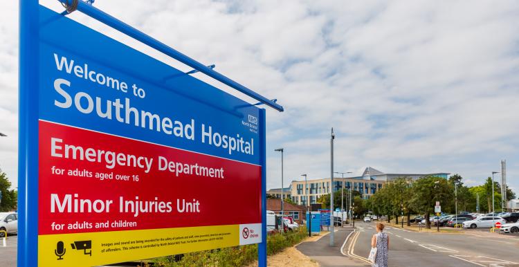 Signs for the Emergency Department and Minor Injuries Unit at the entrance to Southmead Hospital.