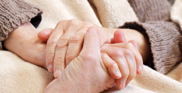 Two people holding hands