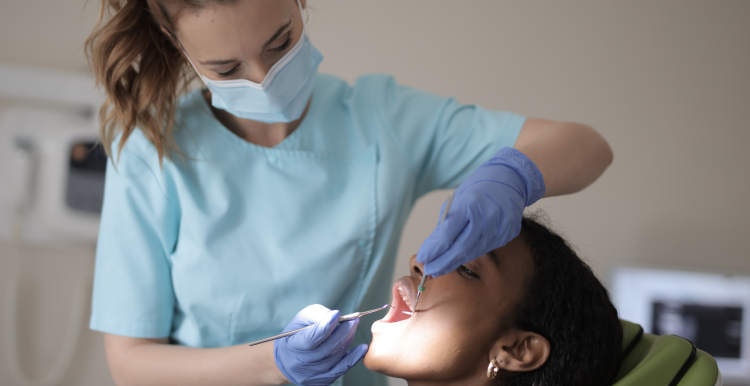 A dentist examining a patient
