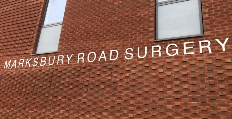 A brick building. Sign reads 'Marksbury Road Surgery'