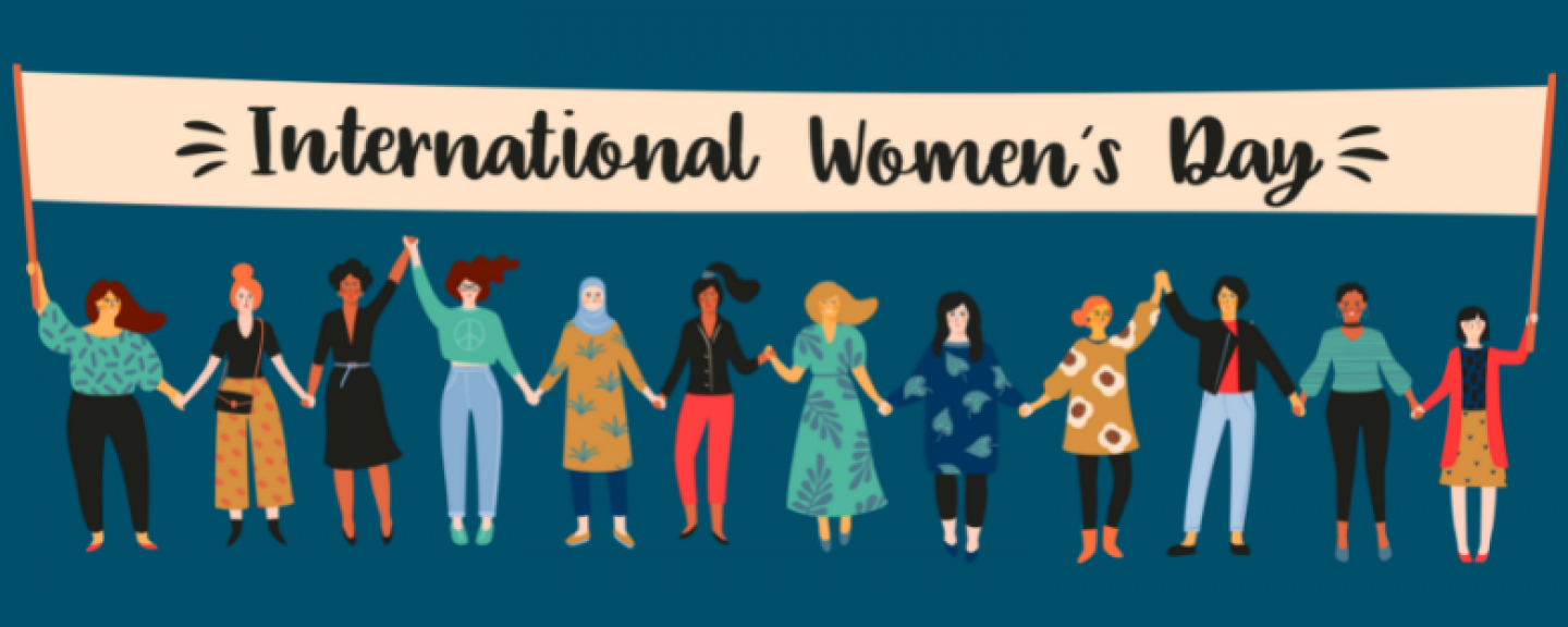 Cartoon-style graphic of 12 women standing in a line, holding a banner which reads: International Women's Day