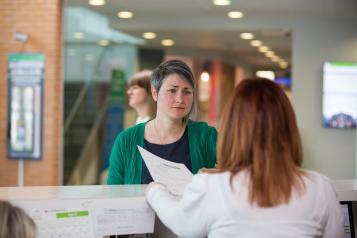 A person at a reception desk