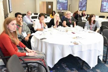 Participants sitting round a large table