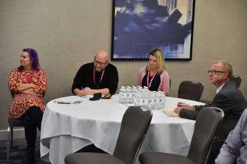 Participants sitting round a large table