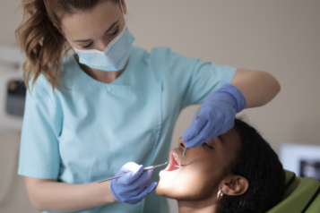 Woman having dental work done