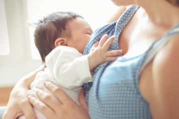 A mother breastfeeding her baby