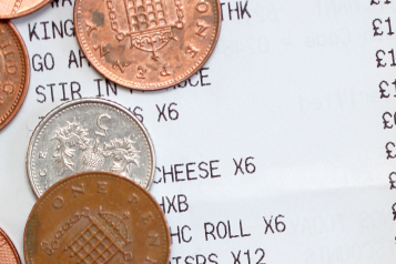 Coins on top of a shopping receipt