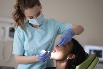 A dentist examining a patient