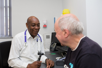 A doctor talking to a patient A doctor talking to a patient